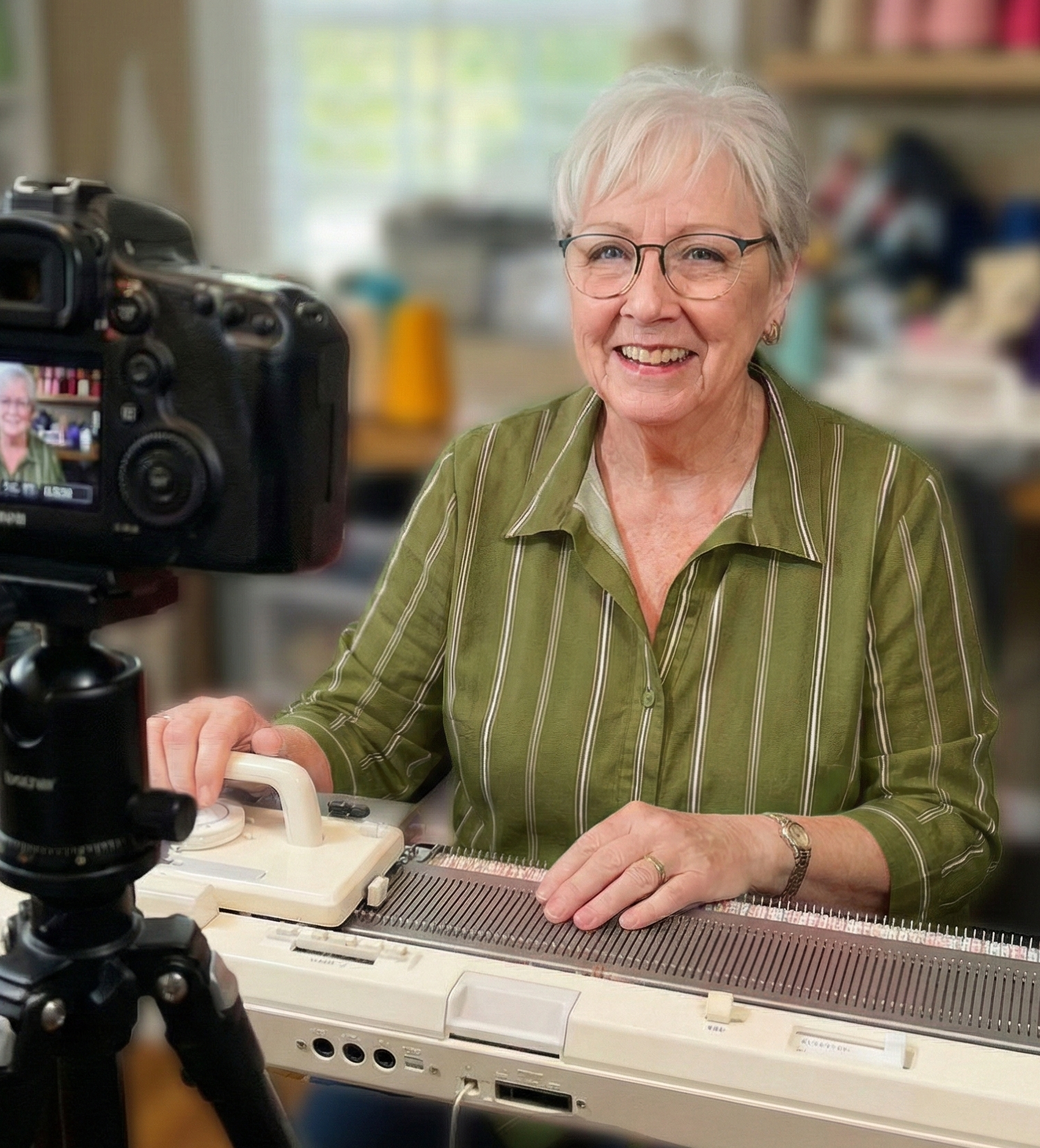 Sue at her knitting machine, ready to guide you
